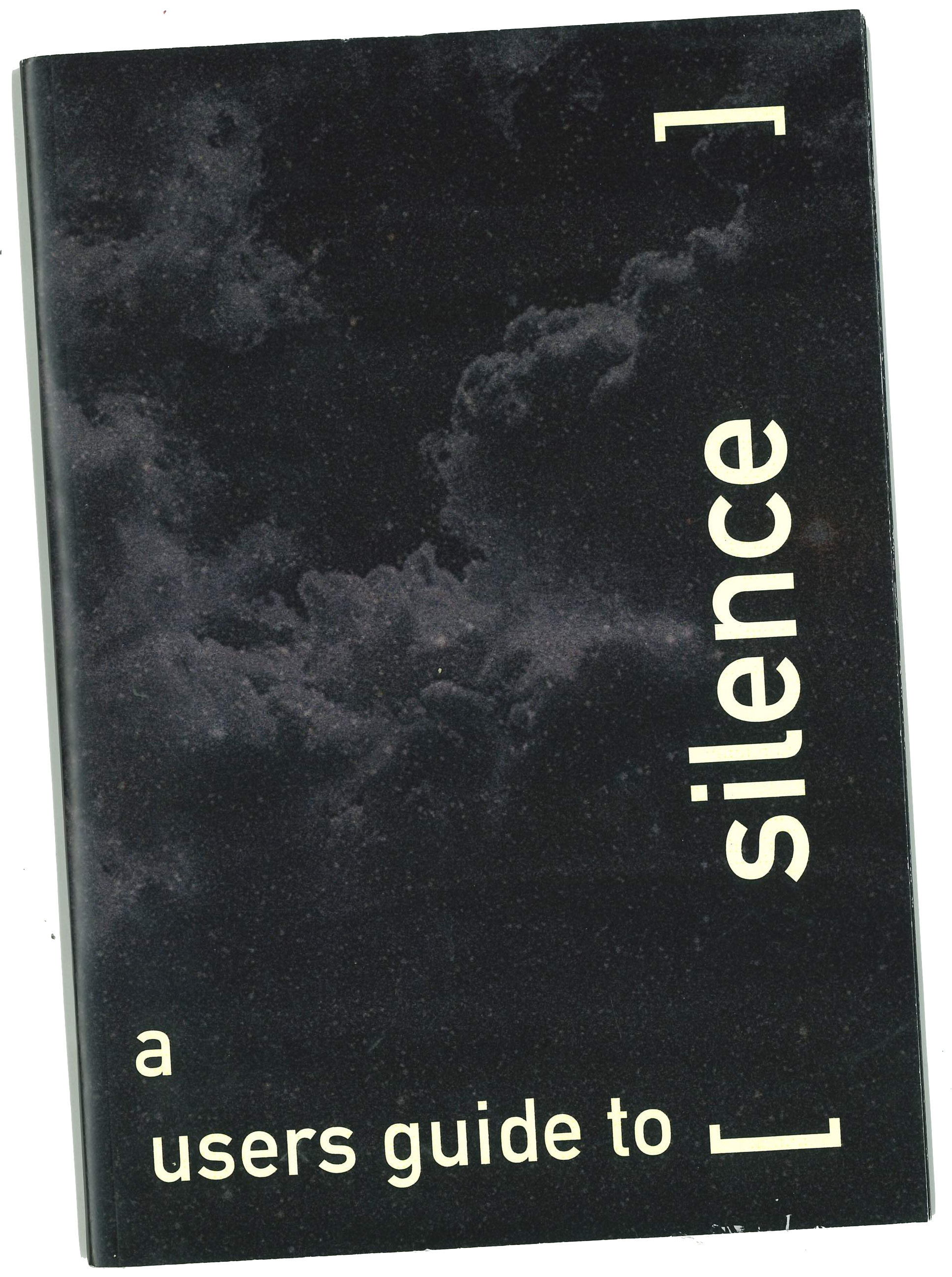 Image of a Magazine cover, it features three small people sitting on the bridge of a guitar